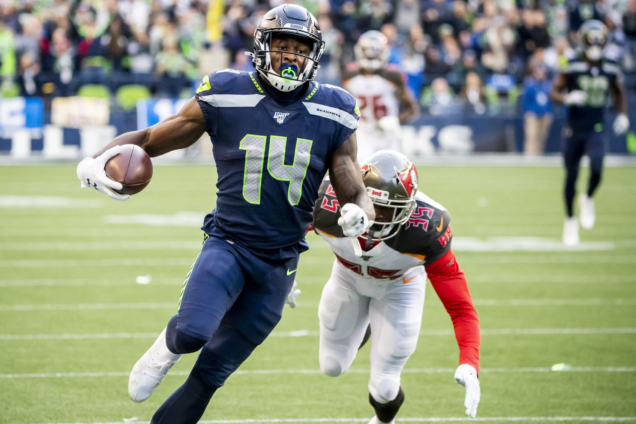 Seattle Seahawks wide receiver DK Metcalf (14) during an NFL football game  against the Denver Broncos, Monday, Sept. 12, 2022, in Seattle, WA. The  Seahawks defeated the Bears 17-16. (AP Photo/Ben VanHouten