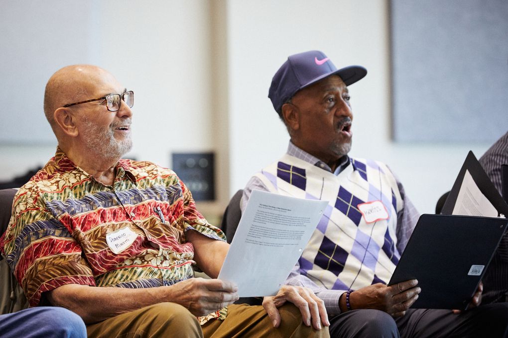 Domenico Minotti and Mertiss Thompson, along with other local veterans, rehearse “The Falling and the Rising,” a new chamber opera that, in Seattle Opera’s production, will feature an amateur chorus of veterans. (Philip Newton)