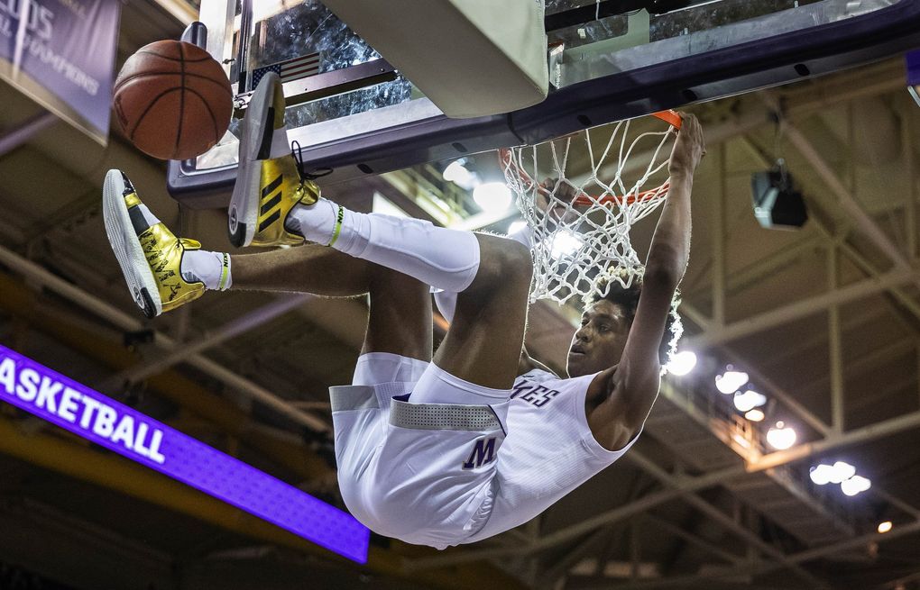 Jaden McDaniel’s emphatic jam gave the Huskies a 43-23 lead over Western Washington on Thursday, October 31, 2019 at Alaska Airlines Arena. (Dean Rutz / The Seattle Times)