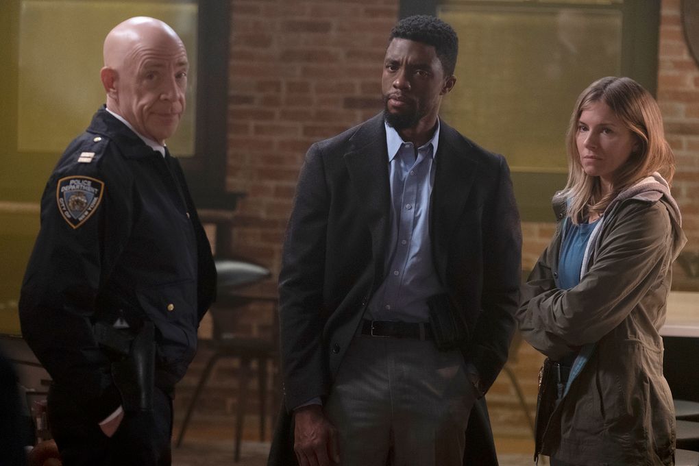 The cast of “21 Bridges” includes, from left, J.K. Simmons, Chadwick Boseman, in one of his final screen performances, and Sienna Miller. (Matt Kennedy / STXfilms).