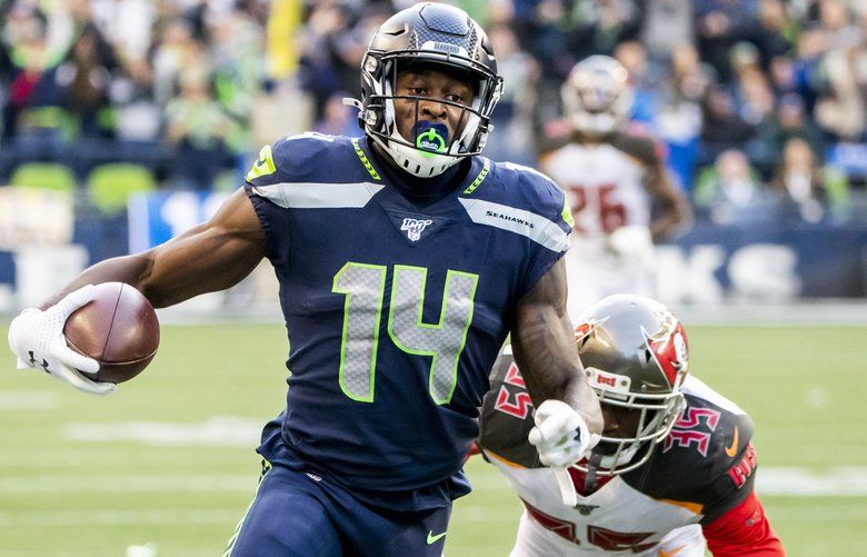 Seattle Seahawks wide receiver DK Metcalf (14) during an NFL football game  against the Denver Broncos, Monday, Sept. 12, 2022, in Seattle, WA. The  Seahawks defeated the Bears 17-16. (AP Photo/Ben VanHouten