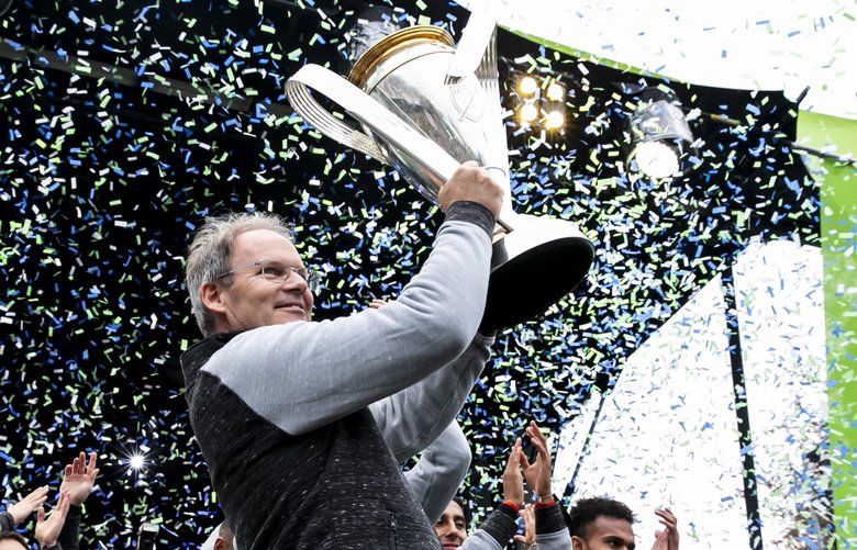 Seattle Sounders head coach Brian Schmetzer smiles at the crowd during the MLS Cup championship celebration at the Seattle Center in Seattle Tuesday, Nov. 12, 2019. 
 212088
