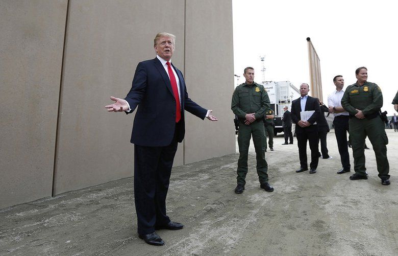 President Donald Trump tours the border wall prototypes near the Otay Mesa Port of Entry in San Diego County, Calif., on March 13, 2018. (K.C. Alfred/San Diego Union-Tribune/TNS) 1512095 1512095