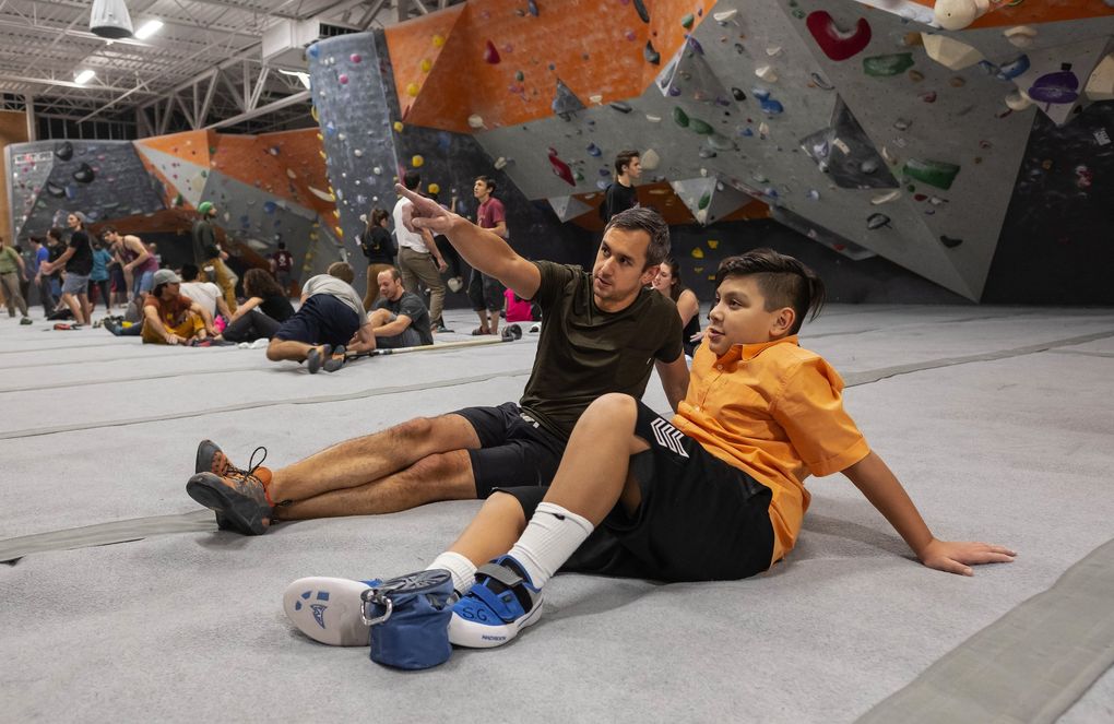 George Lampe, left, sees his effect on Jorge Cuevas-Jimenez this way: “My impact has been being an adult he can trust; someone he feels he can come to if he needs help.” (Dean Rutz / The Seattle Times)