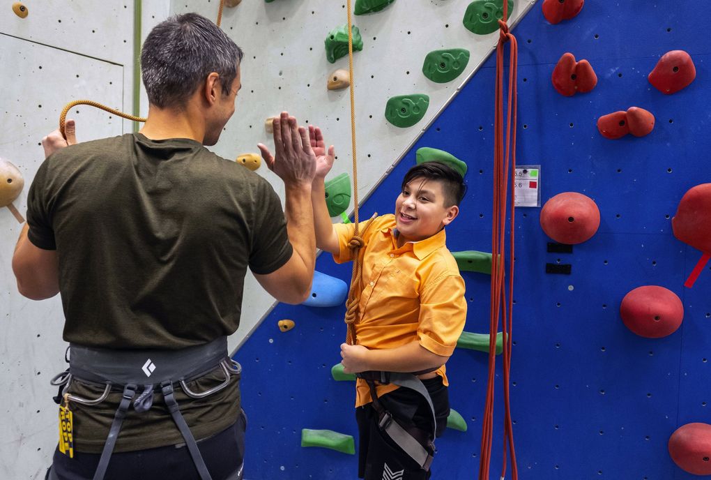 George Lampe, left, was connected to Youth Eastside Services when he was a kid. Jorge’s Cuevas-Jimenez’s mom signed him up for YES’ mentorship program because she wanted a male figure in her son’s life. (Dean Rutz / The Seattle Times)