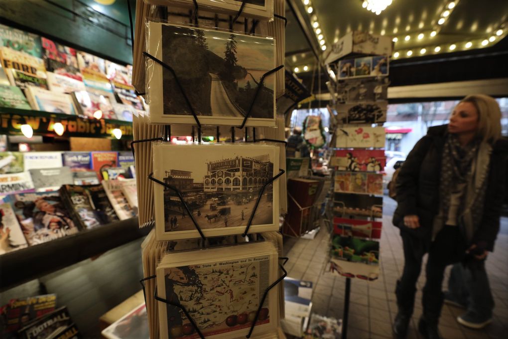 Historic images of Pike Place Market, center, are also sold at First and Pike News. (Alan Berner / The Seattle Times)