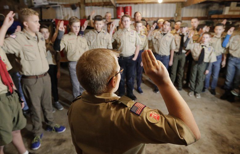 In this Thursday, Dec. 12, 2019 photo, a Boy Scouts troop gathers during their meeting, in Kaysville, Utah. For decades, The Church of Jesus Christ of Latter-day Saints was one of Boy Scouts of America’s greatest allies and the largest sponsor of troops. But on Jan. 1, the Utah-based faith will deliver the latest body blow to the struggling BSA when it implements its plan to pull out more than 400,000 youths and move them into a new global program of its own. This Latter-day Saint-based Boy Scouts troop in Kaysville, though, formed outside the church structure and plans to stick with the Boy Scouts after the church ends its longtime alliance at the end of 2019. (AP Photo/Rick Bowmer) UTRB102 UTRB102