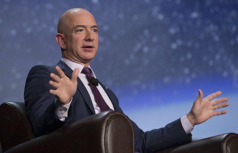 Jeff Bezos, chief executive officer of Amazon.com Inc. and founder of Blue Origin LLC, speaks during the 32nd Space Symposium in Colorado Springs, Colorado, U.S., on Tuesday, April 12, 2016. Commercial space exploration can advance at the fast pace of Internet commerce only if the cost is reduced through advances in reusable rockets, Bezos said. Photographer: Matthew Staver/Bloomberg *** Local Caption *** Jeff Bezos 629349309