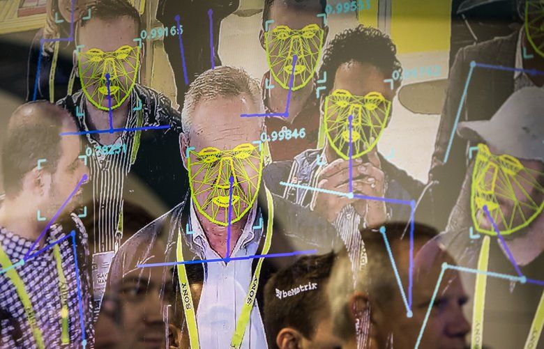 FILE — Attendees interact with a facial recognition demonstration during the Consumer Electronics Show in Las Vegas, Jan. 8, 2019. The San Francisco board of supervisors has enacted the first ban by a major American city on the use of facial recognition technology by police and other municipal agencies. (Joe Buglewicz/The New York Times) XNYT210