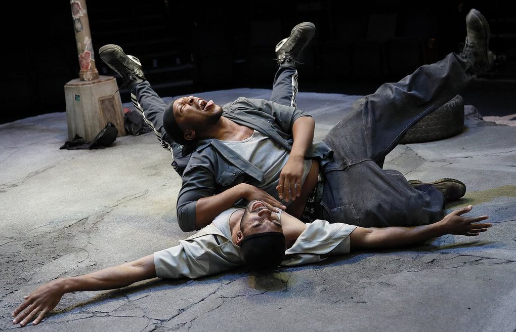 “Pass Over,” Antoinette Nwandu’s lyrical and haunting play with shades of “Waiting for Godot” about two black men literally trapped on a city street corner, played at ACT Theatre. (Chris Bennion)