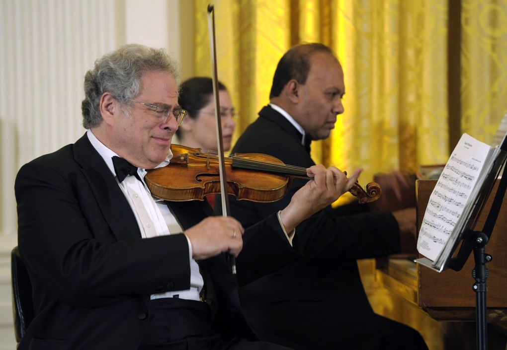 Violinist Itzhak Perlman, shown here in a 2012 performance at the White House, comes to Benaroya Hall on Jan. 15. (Susan Walsh / AP)