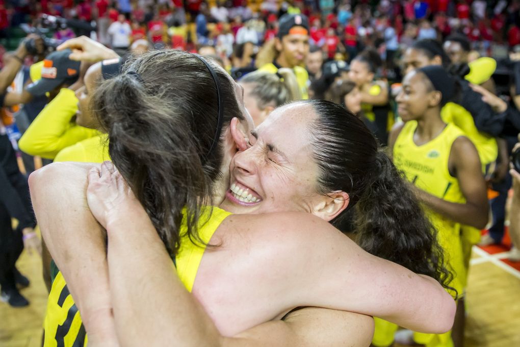 Storm guard Sue Bird hugs forward Breanna Stewart after the Seattle Storm swept the Washington Mystics to win their third WNBA title. (Bettina Hansen / The Seattle Times, 2018)