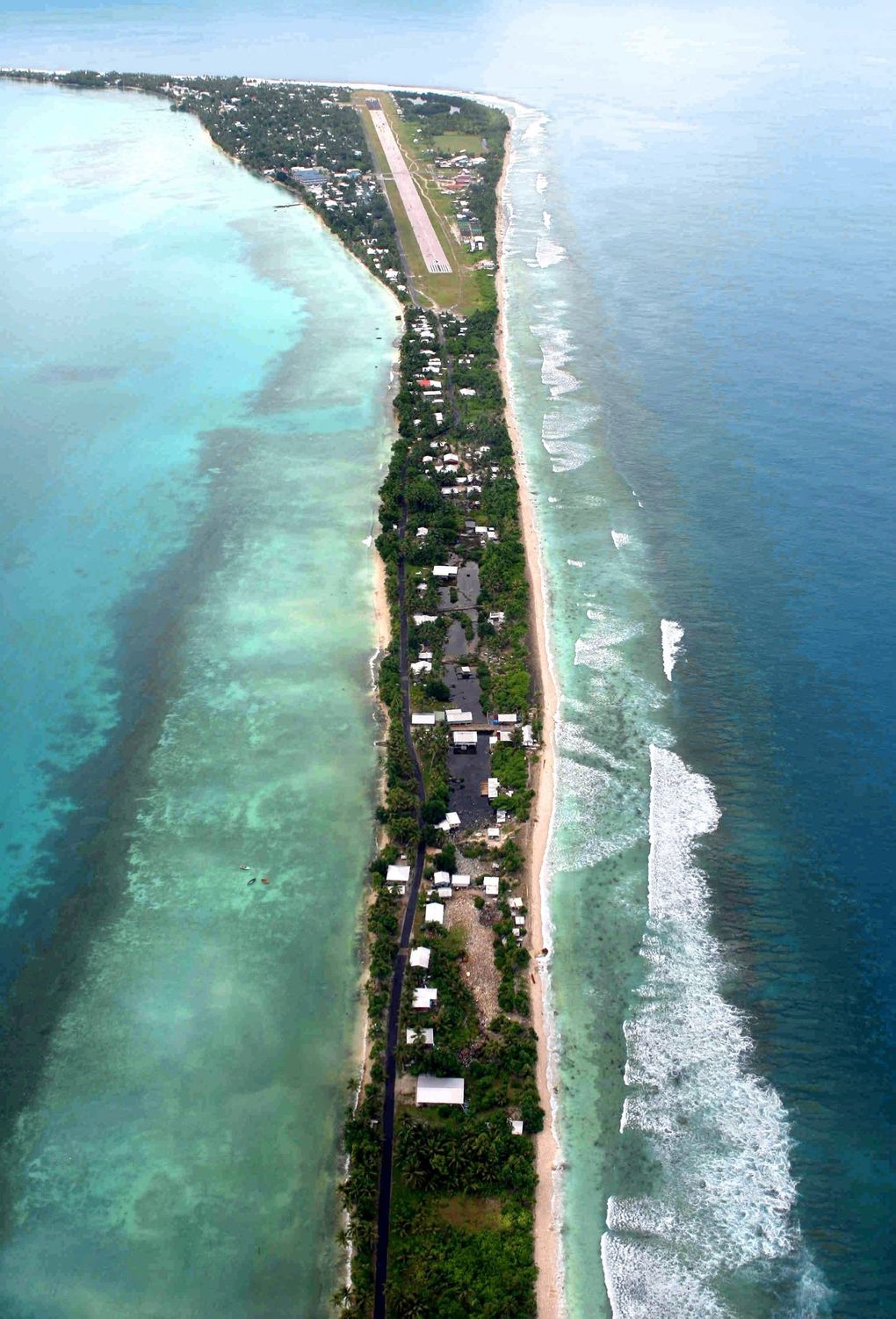 A stroke of luck at the dawn of the internet era is paying big dividends for the South Pacific island nation of Tuvalu in the streaming era. An aerial view in 2007 shows Tuvalu’s capital Funafuti. (AP Photo / Asahi Shimbun, Soichiro Yamamoto)