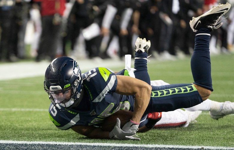 Seattle Seahawks wide receiver John Ursua (15) catches a 15-yard pass from Russell Wilson and stops just short of the end zone in the fourth quarter as the San Francisco 49ers play the Seattle Seahawks at CenturyLink Field in Seattle on December 29, 2019. 212495 212495