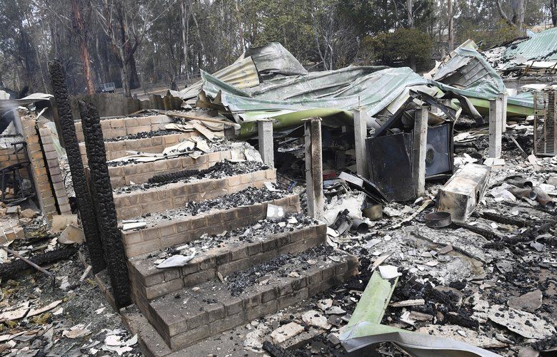A burnt-out residence is seen in Sarsfield, East Gippsland, Victoria, Tuesday, Dec. 31, 2019. Wildfires burning across Australia’s two most-populous states trapped residents of a seaside town in apocalyptic conditions Tuesday and were feared to have destroyed many properties and caused fatalities. (James Ross/AAP Images via AP) TKSJ812 TKSJ812