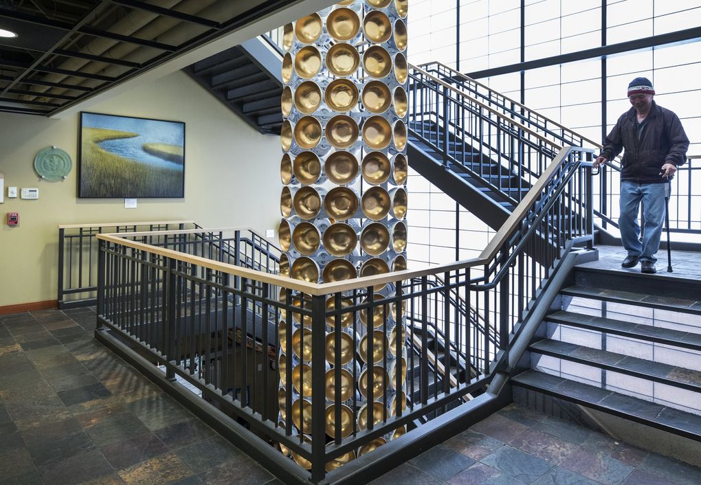 The central staircase at Asian Counseling and Referral Service headquarters, where executive director Michael Byun says, “We’re bursting at the seams.” (Steve Ringman / The Seattle Times)