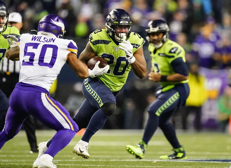 Running back Chris Carson of the Seattle Seahawks runs a pass route