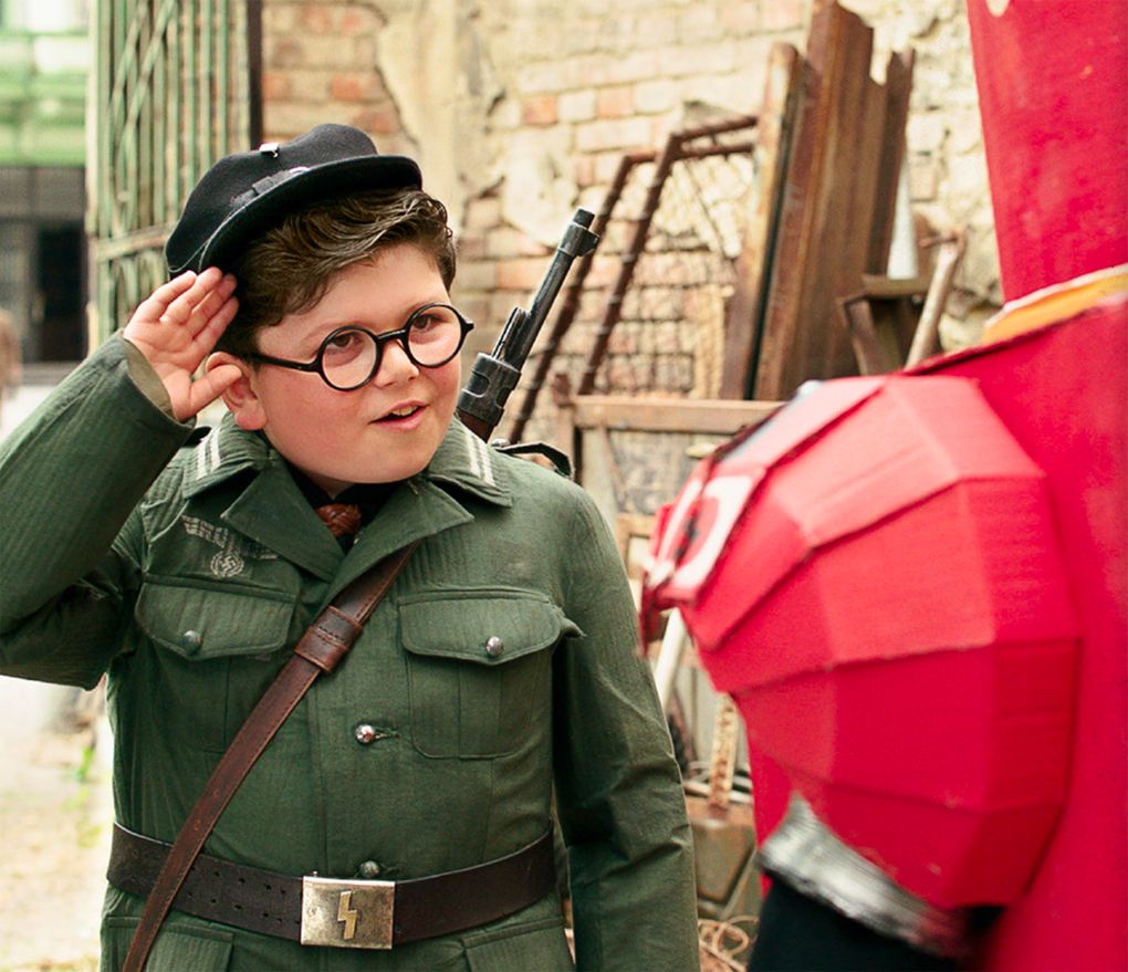 Archie Yates plays Yorki in “Jojo Rabbit,” for which the production design walks the line between a child’s fantasy and a dire reality. (Courtesy of Fox Searchlight Pictures)
