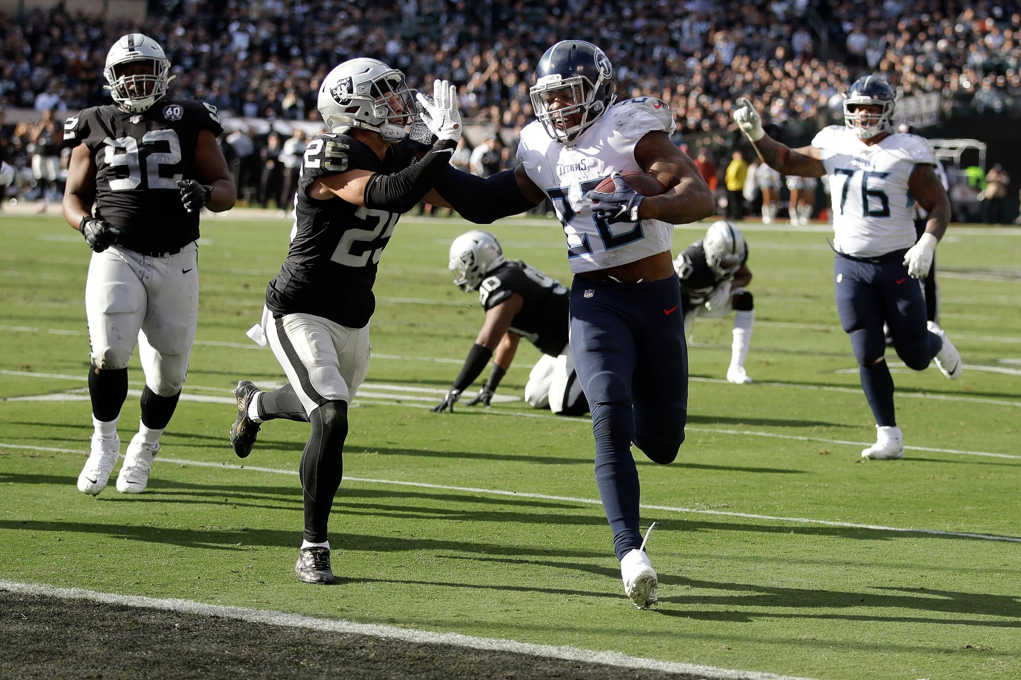 Tennessee Titans running back Derrick Henry (22) celebrates his touchdown  with Tennessee Titans quarterback Marcus Mariota (8) during the second half  of an NFL football game against the Jacksonvil …