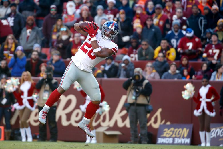 Washington Redskins free safety Montae Nicholson (left) chases New York  Giants running back Saquon Barkley (right) an NFL football game between the  New York Giants and the Washington Redskins, Sunday, Dec. 22