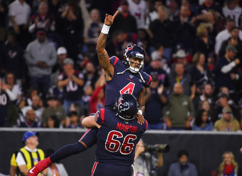 Houston Texans quarterback Deshaun Watson looks to throw during the