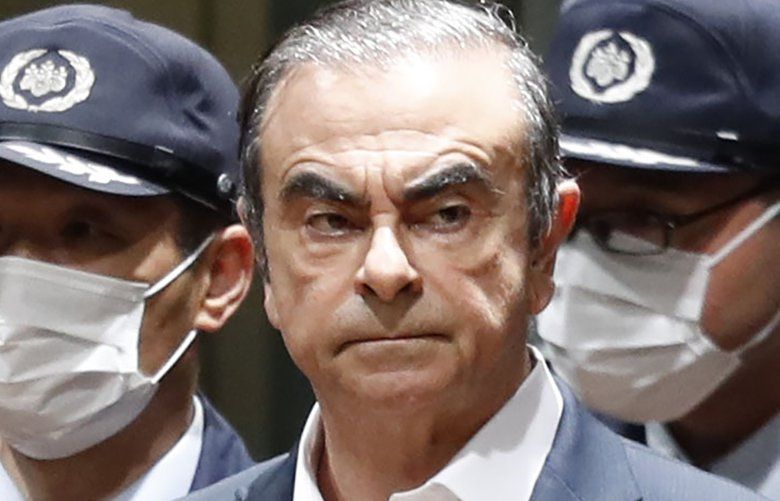 FILE – In this April  25, 2019, file photo, former Nissan Chairman Carlos Ghosn leaves Tokyo’s Detention Center for bail in Tokyo. By jumping bail, Ghosn, who had long insisted on his innocence, has now committed a clear crime and can never return to Japan without going to jail. (Kyodo News via AP, File) TKSJ810 TKSJ810