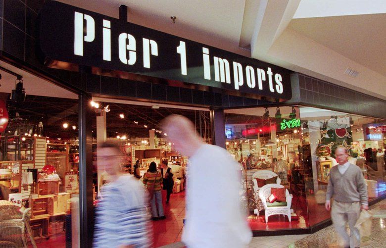 Shoppers walk past a Pier 1 Imports in Dallas, Tuesday, Dec. 26, 1995. . (AP Photo/Eric Gay)