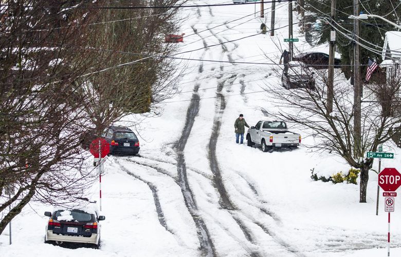 With winter weather on the way in the Seattle area, remember the No. 1 rule for driving in the snow: Slow down. (Bettina Hansen / The Seattle Times)