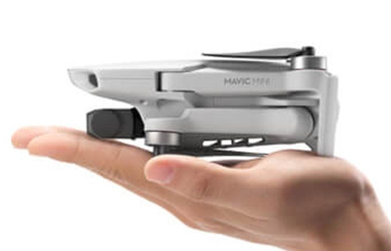 The DJI Mavic Mini, folded up it fits in the palm of your hand. (DJI/TNS) 1534859 1534859