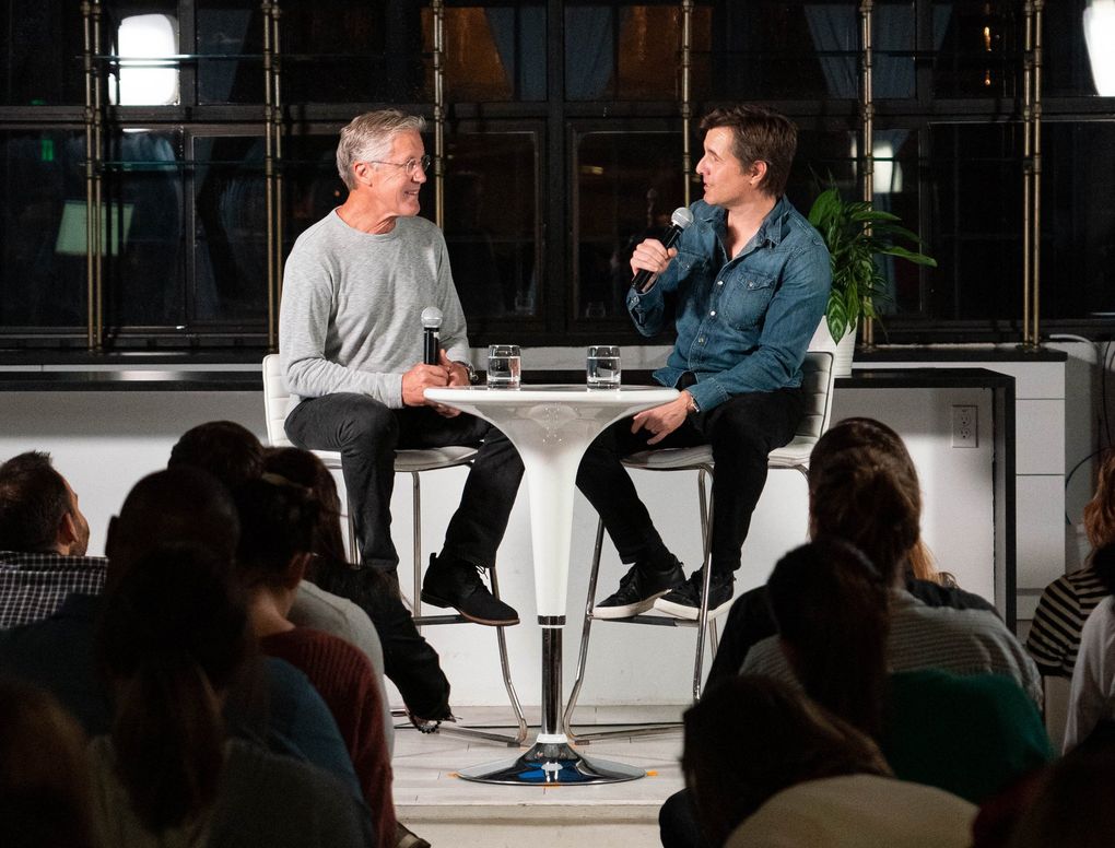 Seahawks coach Pete Carroll and high-performance psychologist Dr. Michael Gervais talk during a Compete to Create training session this fall in Seattle. Their program’s aim is to show people their potential and give them the tools to reach it. (Alex Wood / Compete to Create)