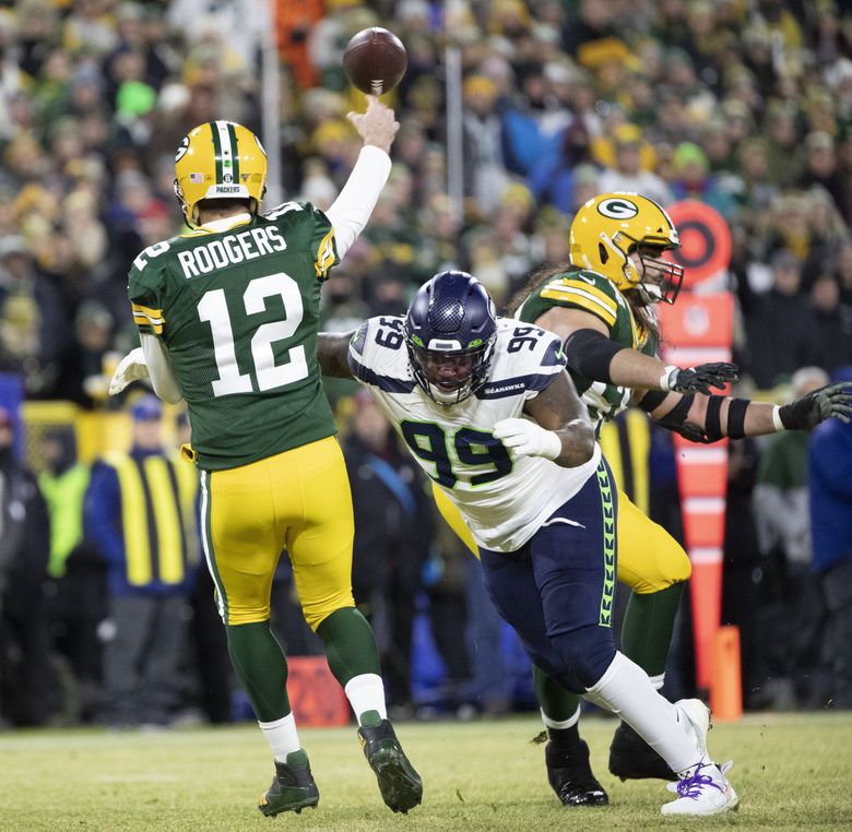 Green Bay Packers defensive tackle Jarran Reed (90) walks on the