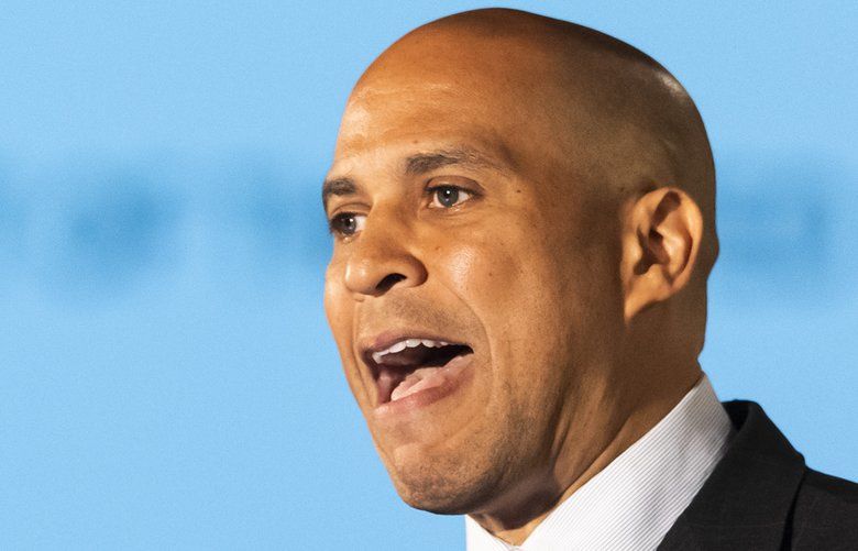 FILE – In this June 6, 2019 file photo, Democratic presidential candidate Sen. Cory Booker, of New Jersey, speaks during the African American Leadership Council Summit in Atlanta. Booker has dropped out of the presidential race after failing to qualify for the December primary debate. (AP Photo/John Amis) WX103 WX103