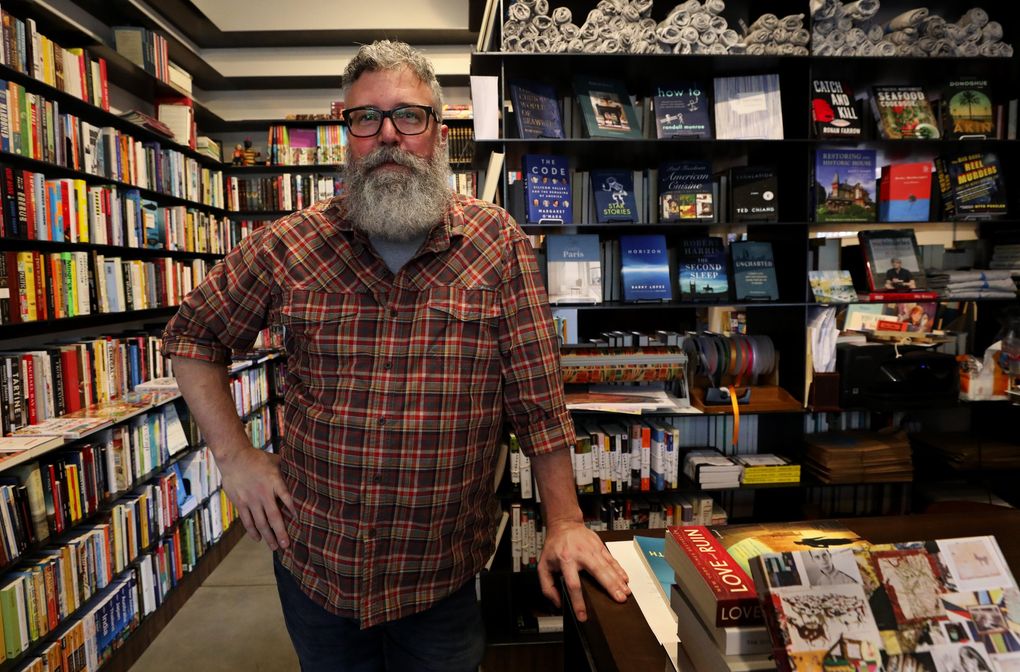 James Crossley is the manager of Madison Books, the neighborhood’s small independent store that’s been open for a little more than a year. (Alan Berner / The Seattle Times)