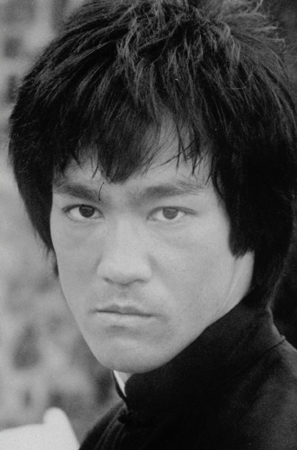 Bruce Lee poses in his last motion picture, 1979’s “Game of Death,” in which he plays a martial arts star being harassed by an underworld syndicate. The late martial artist would have turned 80 years old in 2020. (The Associated Press)