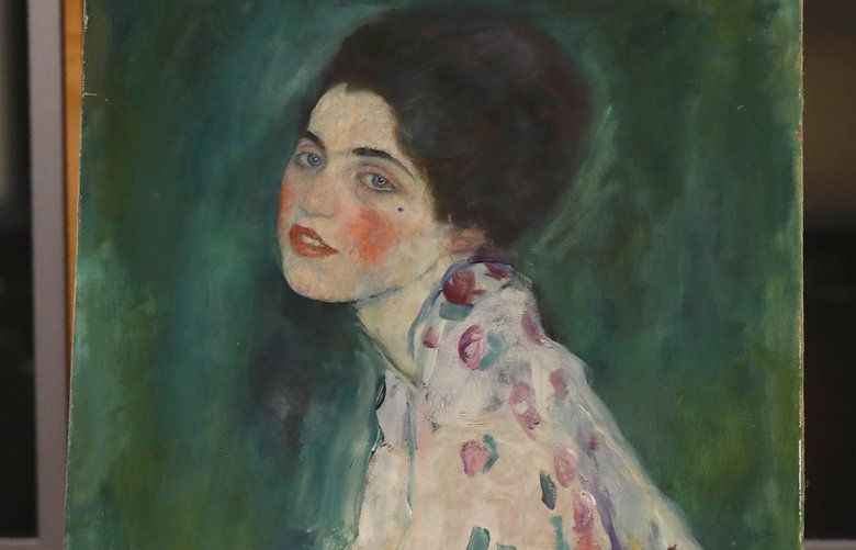 The painting which was found last December near an art gallery and believed to be the missing Gustav Klimt’s painting â€˜Portrait of a Ladyâ€™ is displayed during a press conference in Piacenza, Italy, Friday, Jan. 17, 2020. Art experts have confirmed that a stolen painting discovered hidden inside an Italian art gallery’s walls is Gustav Klimt’s “Portrait of a Lady,” Italian prosecutors said Friday. A gardener reported finding an art work inside a bag last month while clearing ivy at the Ricci Oddi Modern Art Gallery in the northern city of Piacenza. â€œPortrait of a Ladyâ€ disappeared from the gallery during renovation work in February 1997. (AP Photo/Antonio Calanni) XAC101 XAC101