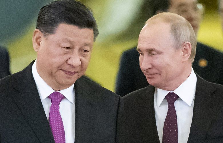 FILE – In this June 5, 2019, file photo, Russian President Vladimir Putin, center right, and Chinese President Xi Jinping, center left, enter a hall for the talks in the Kremlin in Moscow, Russia. Putin and Xi have established themselves as the worldâ€™s most powerful authoritarian leaders in decades. Now it looks like they want to hang on to those roles indefinitely. Putin’s sudden announcement of constitutional changes that could allow him to extend control way beyond the end of his term in 2024 echoes Xiâ€™s move in 2018 to eliminate constitutional term limits on the head of state. (AP Photo/Alexander Zemlianichenko, Pool, File) XBEJ102 XBEJ102