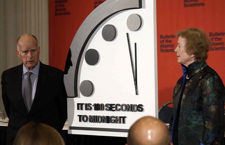 Former California Governor Jerry Brown, executive chair, Bulletin of the Atomic Scientists, left, former President of Ireland Mary Robinson, chair, The Elders, and former UN Secretary-General Ban Ki-moon, deputy chair, The Elders, during a presentation of moving the hands of the Doomsday Clock closer to midnight during an event in Washington D.C. on Jan. 23, 2020. (Bulletin of the Atomic Scientists) 1550827 1550827
