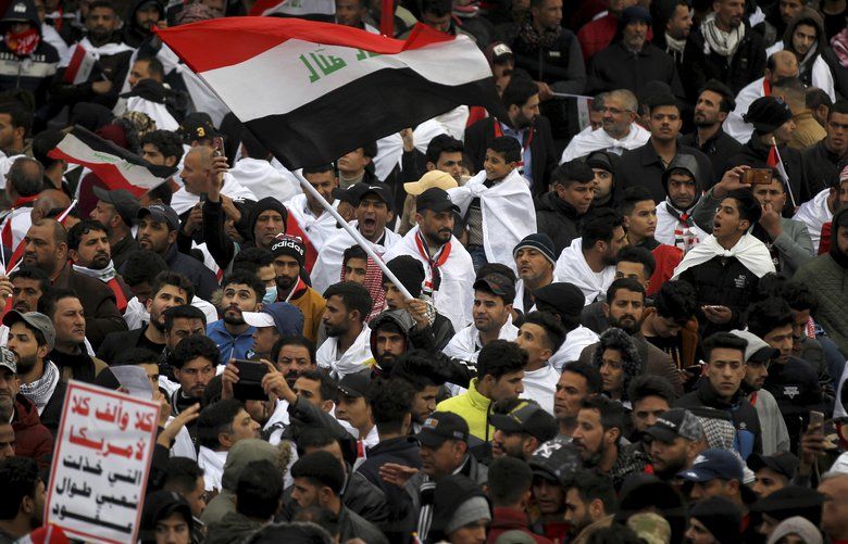 Followers of Shiite cleric Muqtada al-Sadr gather in Baghdad, Iraq, Friday, Jan. 24, 2020. Thousands of supporters of an influential, radical Shiite cleric gathered Friday in central Baghdad for a rally to demand that American troops leave the country amid heightened anti-US sentiment after a drone strike ordered by Washington earlier this month killed a top Iranian general in the Iraqi capital. (AP Photo) BAG112 BAG112