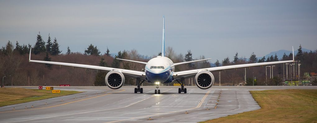 Boeing’s 777X prepares to take off on its first flight from Paine Field in Everett on Saturday. The 777X features giant carbon-composite wings, the largest Boeing has ever designed. The wings are so long that to fit at standard airport gates, each has to fold upward on a hinge 11 feet from the tip.
(Mike Siegel / The Seattle Times)