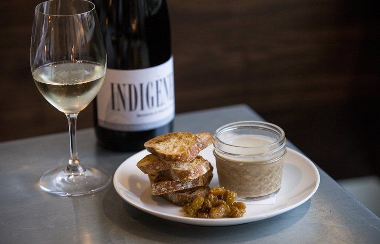Petite Soif’s chicken liver pate served with Domaine Andre et Mireille Tissot Cremant du Jura, from Jura, France. Petite Soif is a new wine shop and bar on Beacon Hill. 212740
