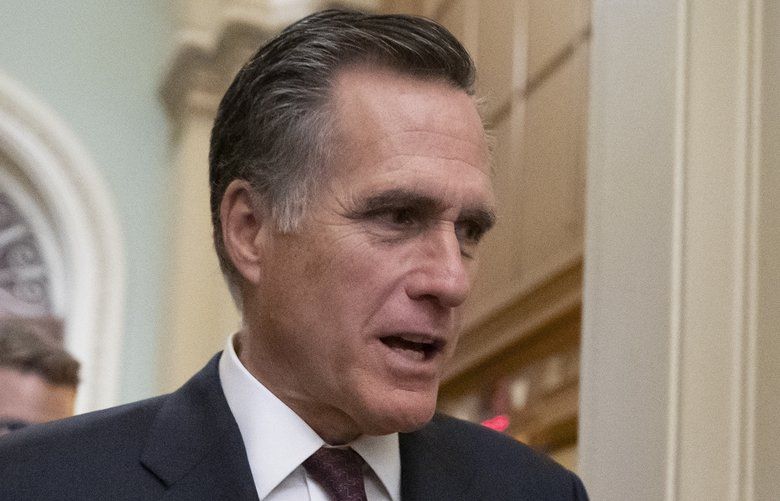 Sen. Mitt Romney, R-Utah, arrives as defense arguments by the Republicans resume in the impeachment trial of President Donald Trump on charges of abuse of power and obstruction of Congress, at the Capitol in Washington, Tuesday, Jan. 28, 2020. (AP Photo/J. Scott Applewhite) DCSA114 DCSA114