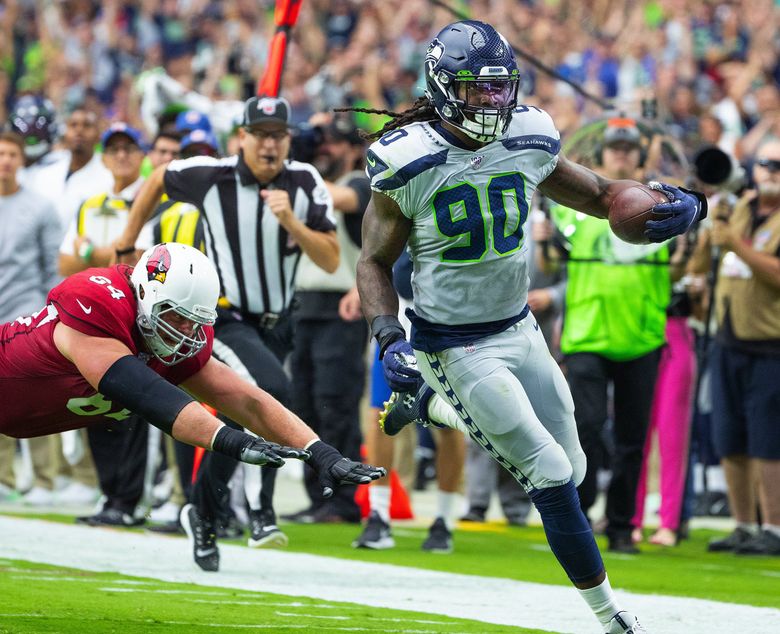 Seattle Seahawks free safety Tedric Thompson intercepts a pass intended for  Los Angeles Rams tight end Gerald Everett (not shown) during the second  half of an NFL football game, Thursday, Oct. 3