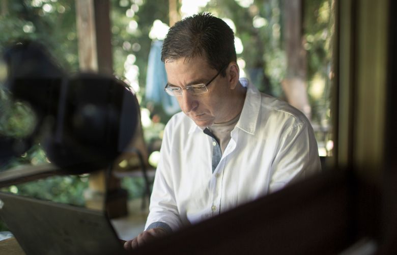 FILE — Glenn Greenwald at his home in Rio de Janeiro, Aug. 1, 2014. Federal prosecutors in Brazil on Jan. 21, 2020, charged the American journalist with cybercrimes for his role in the spreading of cellphone messages that have embarrassed prosecutors and tarnished the image of an anti-corruption task force. (Jimmy Chalk/The New York Times)  XNYT40 XNYT40