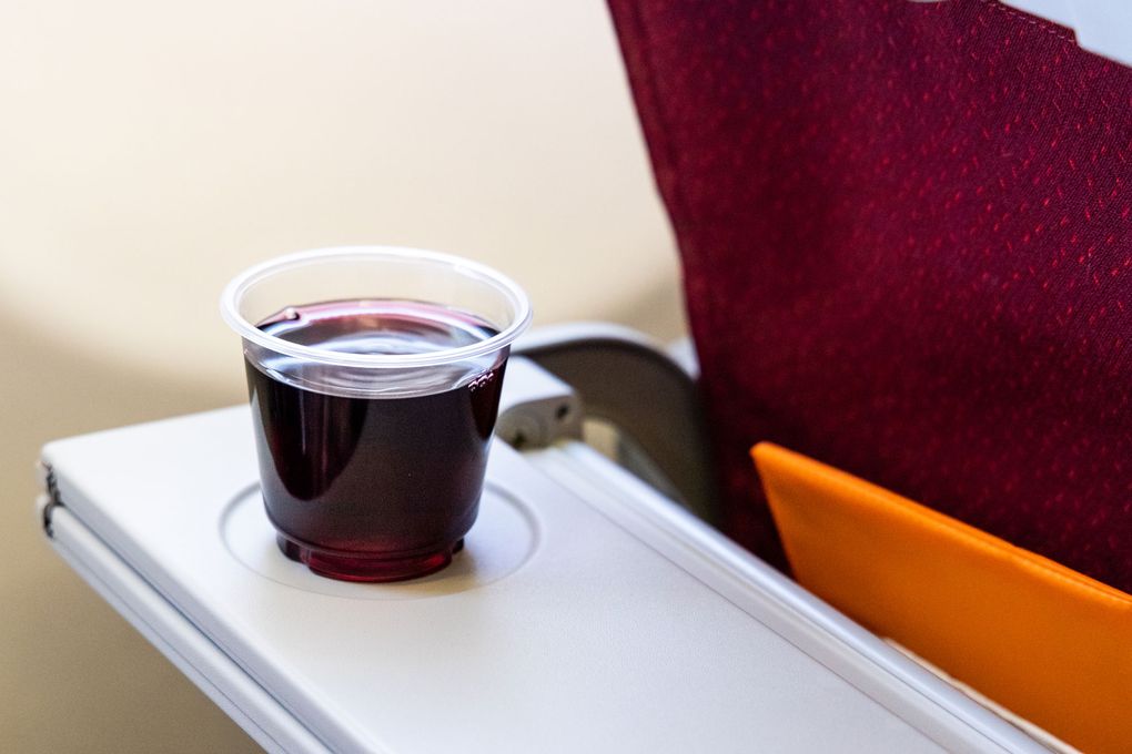 Go ahead and enjoy a drink on the plane, but don’t get drunk. You could end up getting the plane grounded, facing legal ramifications and paying fines in the tens of thousands of dollars.(Getty Images)