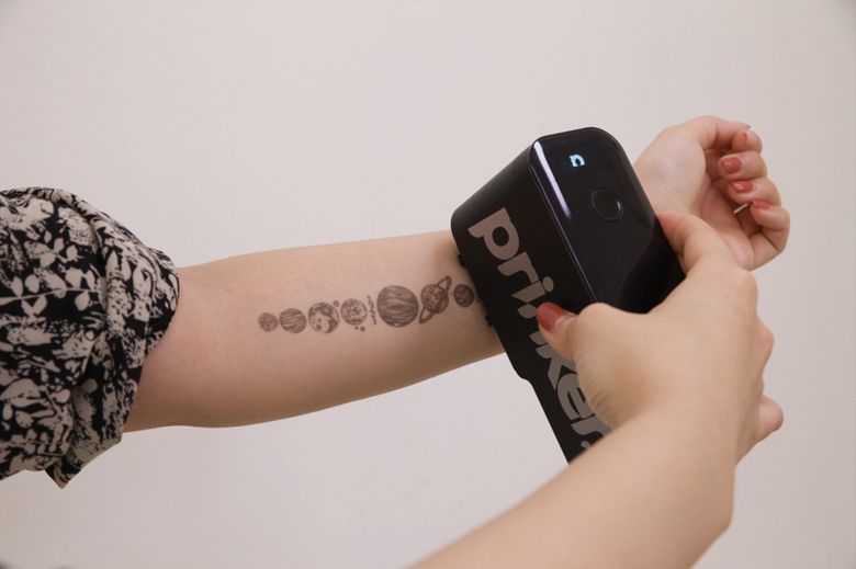 Prinker mobile temporary tattoo printer can instantly print graphics on your skin. (Prinker)