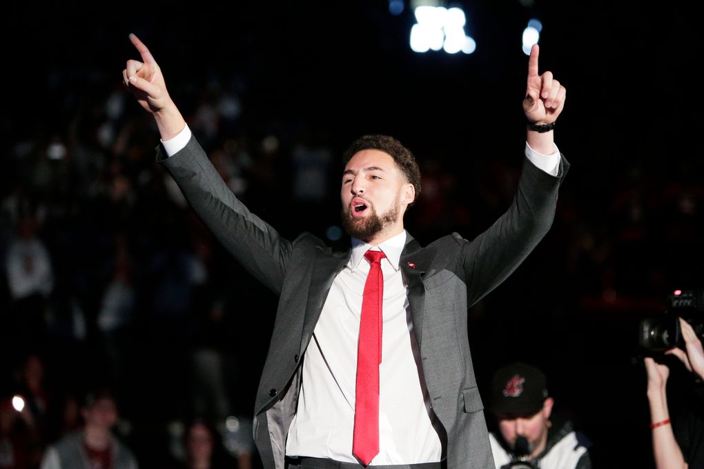 Golden State Warriors and former Washington State guard Klay Thompson walks onto the court as the school retired his jersey number during halftime of an NCAA college basketball game between Washington State and Oregon State in Pullman, Wash., Saturday, Jan. 18, 2020. (AP Photo/Young Kwak)