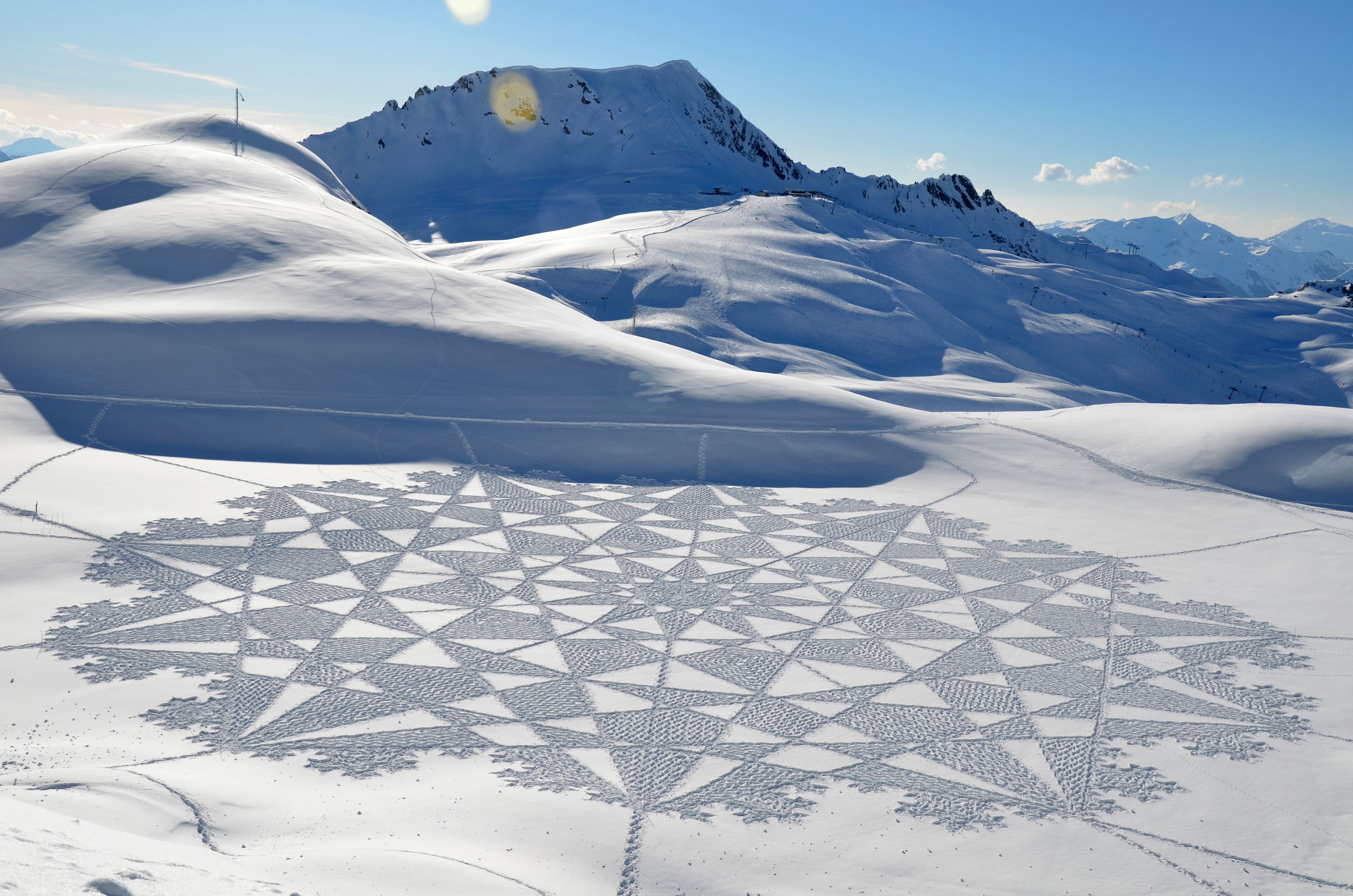 Artist uses snow as canvas for massive geometrical designs | The