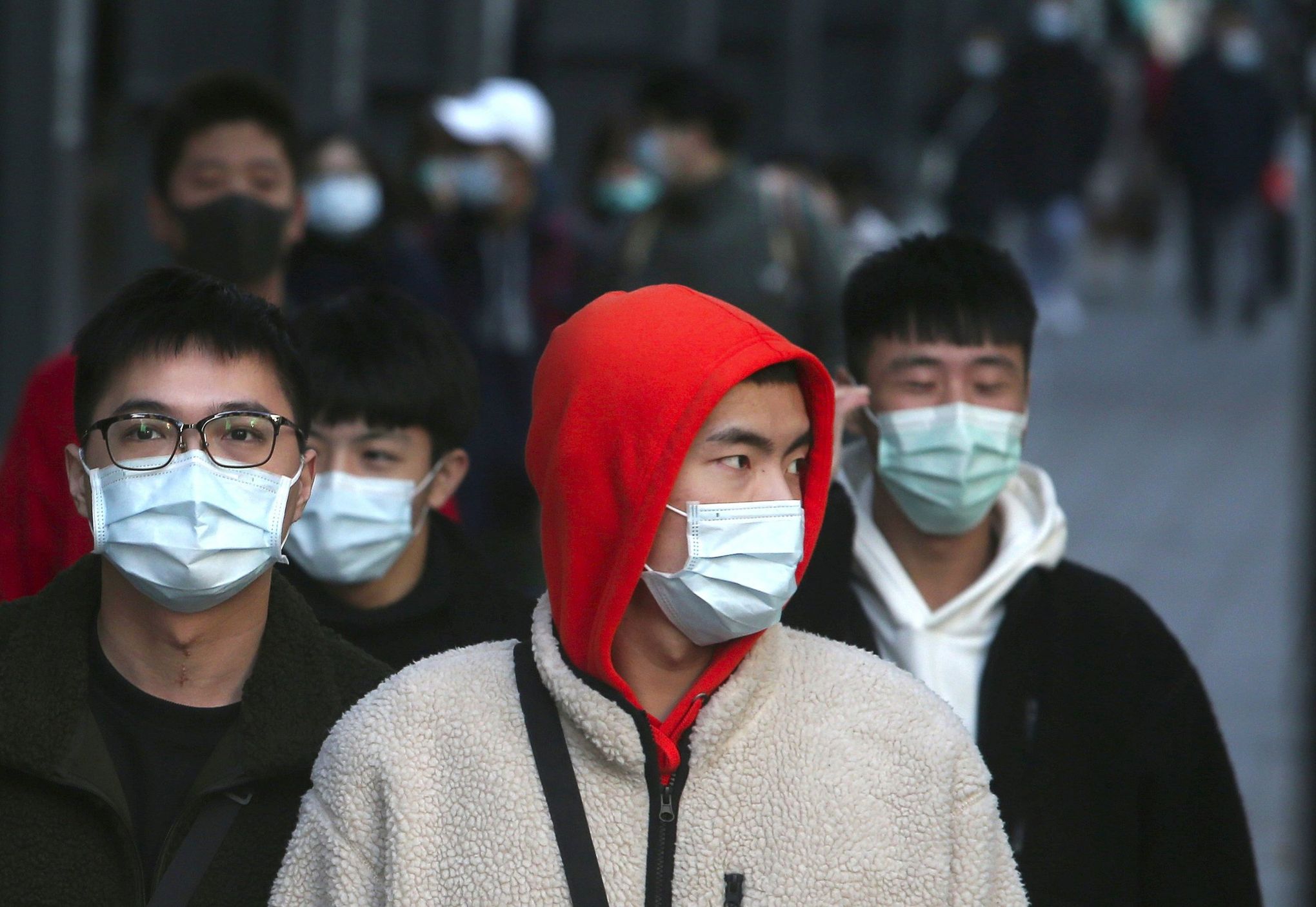 Model He Sui wearing a face mask arrives at an airport on May 19