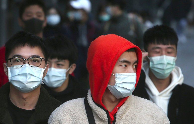 People wear face masks and walk at a shopping mall in Taipei, Taiwan, Friday, Jan. 31, 2020. People wear face masks as they walk through a shopping mall in Taipei, Taiwan, Friday, Jan. 31, 2020. According to the Taiwan Centers of Disease Control (CDC) Friday, the tenth case diagnosed with the new coronavirus has been confirmed in Taiwan. (AP Photo/Chiang Ying-ying) XYY106 XYY106 XYY106