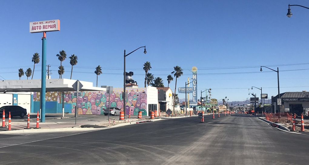 A strip of mostly abandoned motels along Fremont Street in Las Vegas is evidence of the city’s previous life as a destination for families traveling by car. The monsters on the wall behind the “Auto Repair” sign were added more recently as part of a project to transform the former Ferguson’s Motel into a community-oriented gathering space with programming around food and art. (Megan Burbank / The Seattle Times)